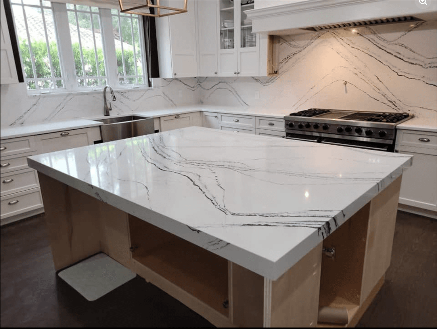 Kitchen with stone countertops and backsplash